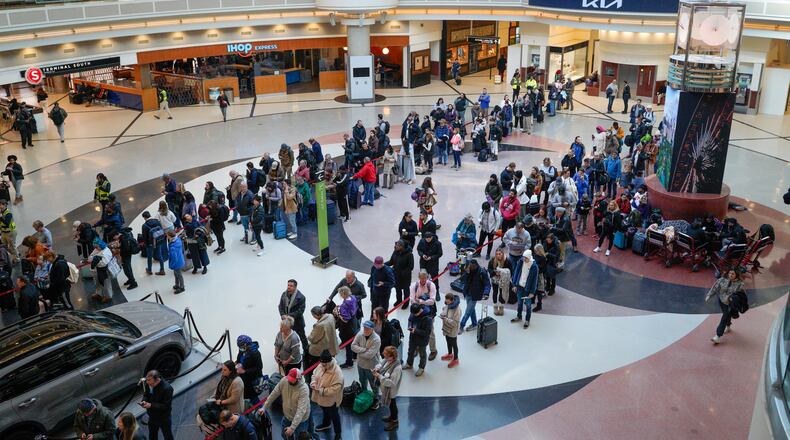 Line wait times in excess of a two hours plague travelers at Atlanta Hartsfield-Jackson International Airport. Wednesday, January 22, 2025 (Ben Hendren for the Atlanta Journal-Constitution)