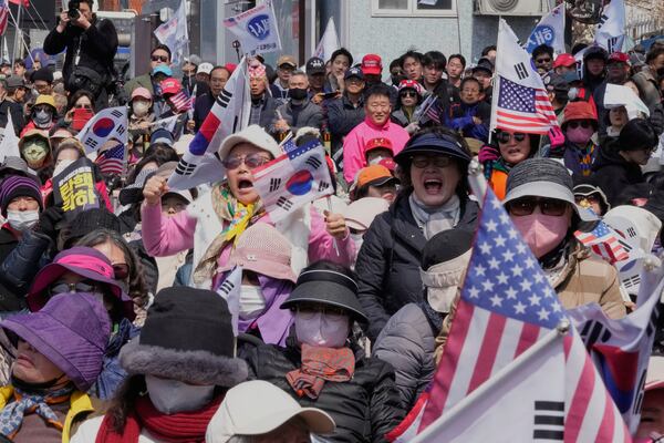 Supporters of impeached South Korean President Yoon Suk Yeol react after hearing the Constitutional Court's verdict removing him from office during a rally in his support near the presidential residence in Seoul, South Korea, Friday, April 4, 2025. (AP Photo/Ahn Young-joon)