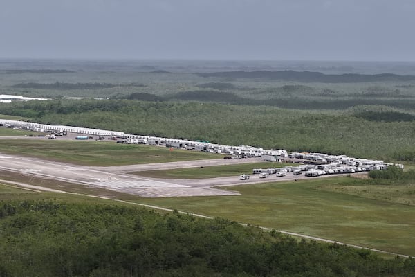 This aerial photo shows that the state is plowing ahead with building a an immigration detention facility with heavy-duty tents, trailers and other temporary buildings at the Miami Dade County-owned airfield in the Big Cypress National Preserve, about 45 miles (72 kilometers) west of downtown Miami, This Friday, June 27, 2025. (AP Photo/Daniel Kozin)