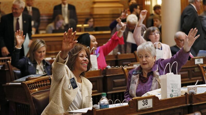 Sen. Horacena Tate (left), D - Atlanta, and Sen. Nan Orrock, D- Atlanta vote against engrossing a bill.  Behind them are Sen. Elena Parent, D - Atlanta, Sen. Nikema Williams, D - Atlanta, and Sen. Sally Harrell, D - Atlanta. The legislature was in session for the 23rd day of the 2019 General Assembly.   Bob Andres / bandres@ajc.com
