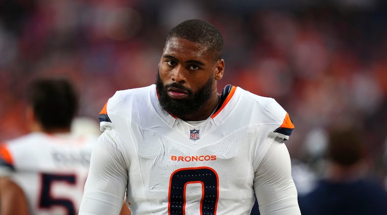 Denver Broncos linebacker Jonathon Cooper walks on the sideline during the first half of a preseason NFL football game against the Minnesota Vikings, Friday, Aug. 28, 2026, in Denver. (AP Photo/Jack Dempsey)