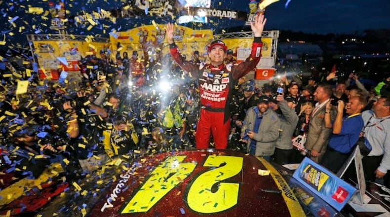 Jeff Gordon celebrates winning the Sprint Cup auto race at the Martinsville Speedway in Martinsville, Va., Sunday, Nov. 1, 2015. (AP Photo/Steve Helber)