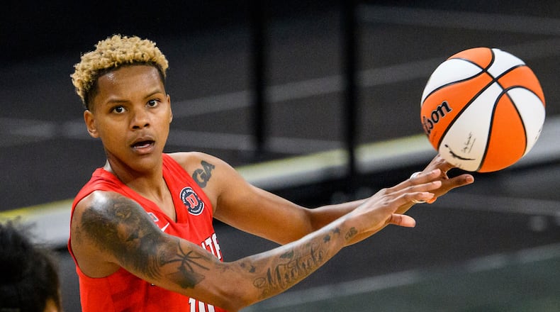 Dream guard Courtney Williams (10) passes the ball during a game against the Dallas Wings, Thursday, May 27, 2021, in College Park, Ga. (AP Photo/Danny Karnik)