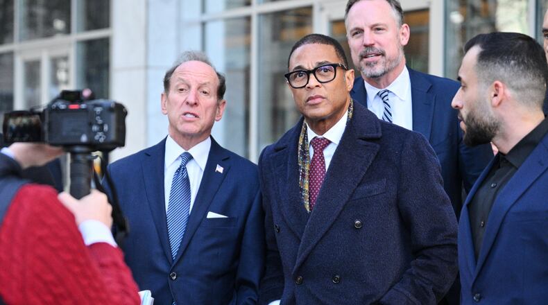 FILE - Journalist Don Lemon, center, exits the U.S. District Courthouse in St. Paul, Minn., Feb. 13, 2026. (AP Photo/Tom Baker, File)