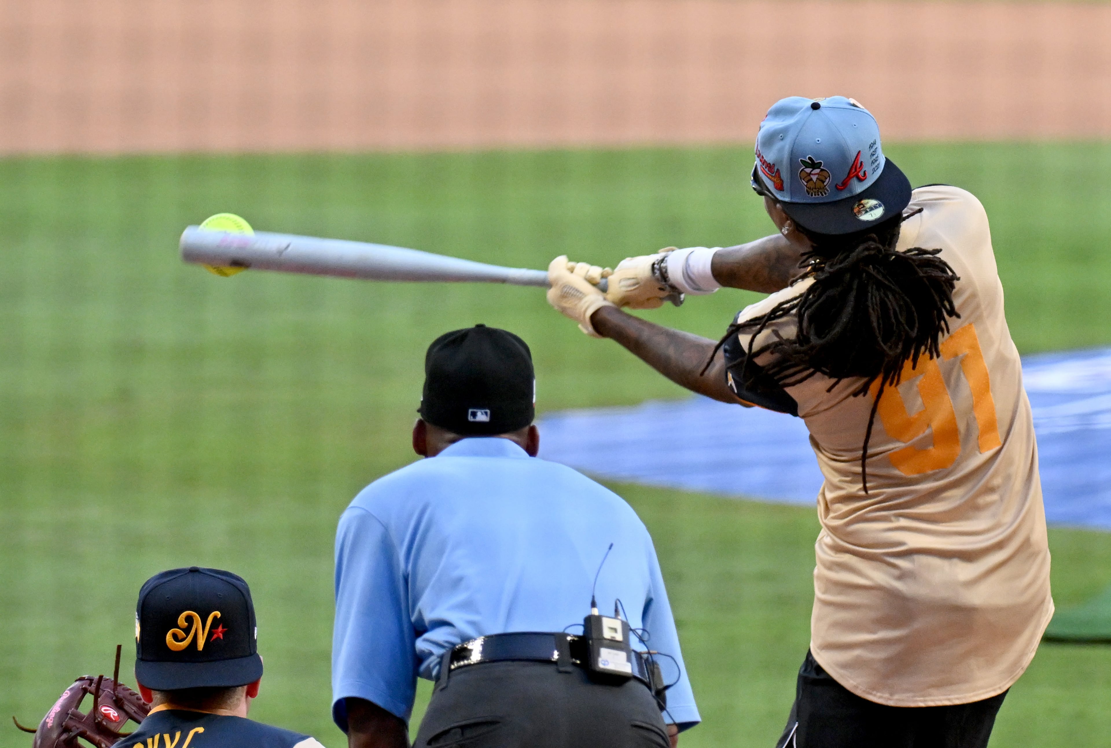 American League’s Quavo hits a double during the MLB All-Star Celebrity Softball Game at Truist Park, Saturday, July 12, 2025, in Atlanta. (Hyosub Shin / AJC)