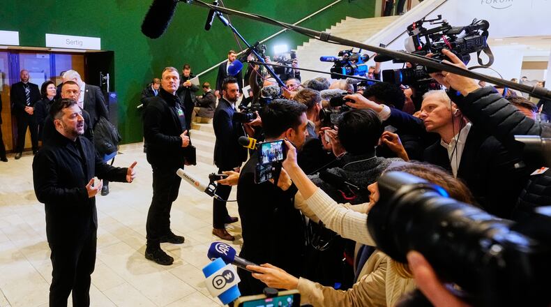Ukraine's President Volodymyr Zelenskyy talks to the media at the Annual Meeting of the World Economic Forum in Davos, Switzerland, Thursday, Jan. 22, 2026. (AP Photo/Markus Schreiber)