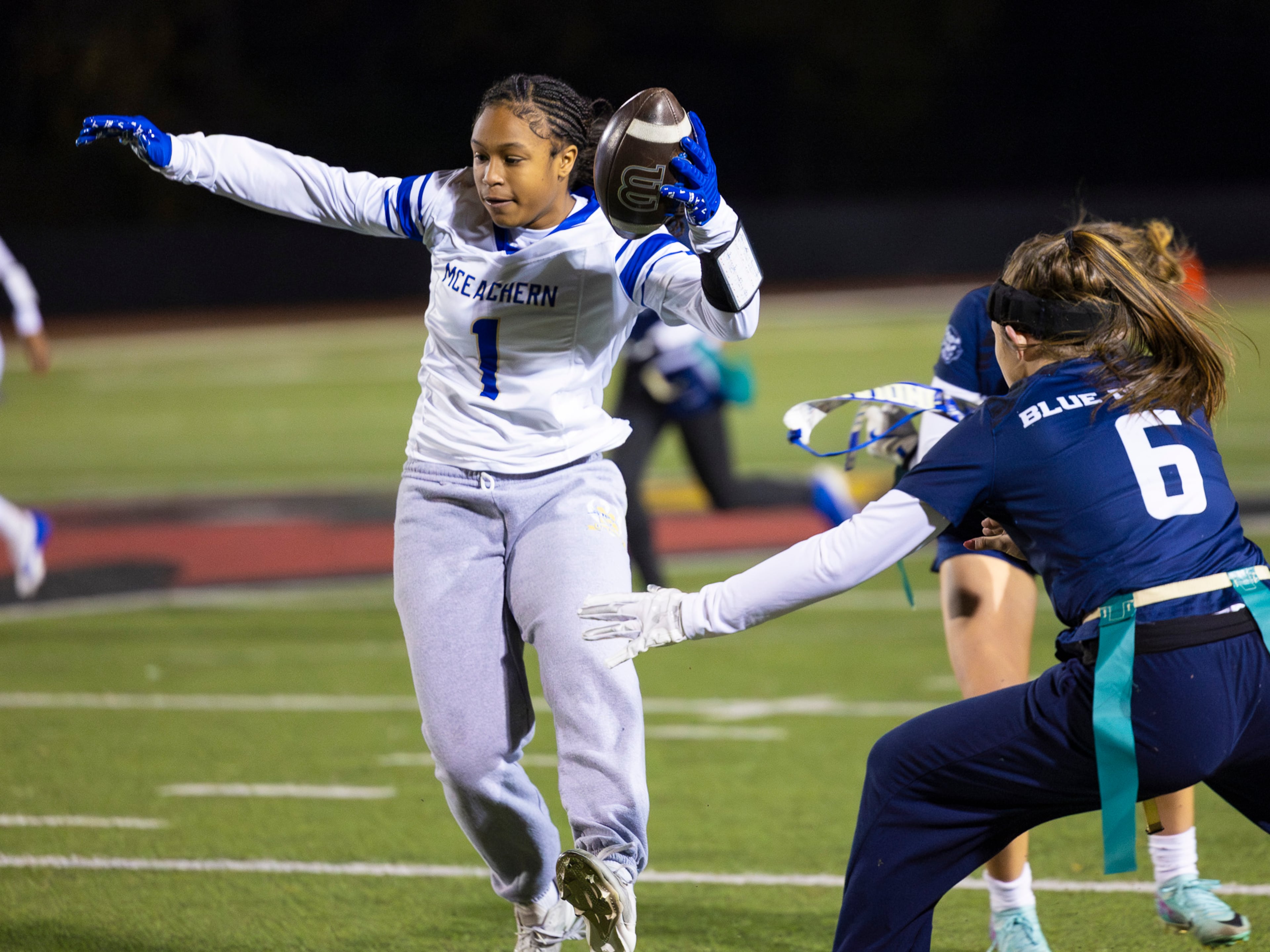 McEachern wide receiver Michala Butler (1) gets her flag pulled in a flag football game against Marietta at Osborne High School in Marietta, GA on Monday, November 17th, 2025. (Oscar Guevara Saenz for the AJC)
