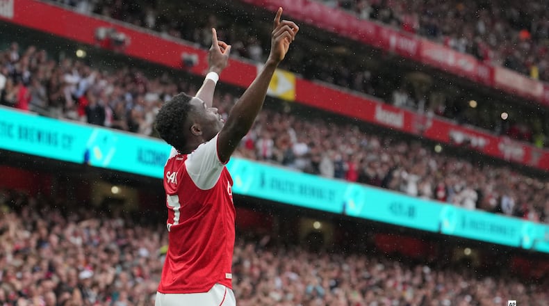 Arsenal's Bukayo Saka celebrates after scoring his side's second goal during the English Premier League soccer match between Arsenal and Fulham in London, England, Saturday, May 2, 2026. (AP Photo/Kin Cheung)