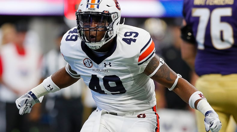 Auburn linebacker Darrell Williams much enjoys a stop against Washington. (Kevin C. Cox/Getty Images)