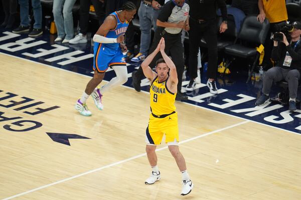 Indiana Pacers guard T.J. McConnell (9) motions after a basket against the Oklahoma City Thunder during the second half of Game 3 of the NBA Finals basketball series, Wednesday, June 11, 2025, in Indianapolis. (AP Photo/Michael Conroy)