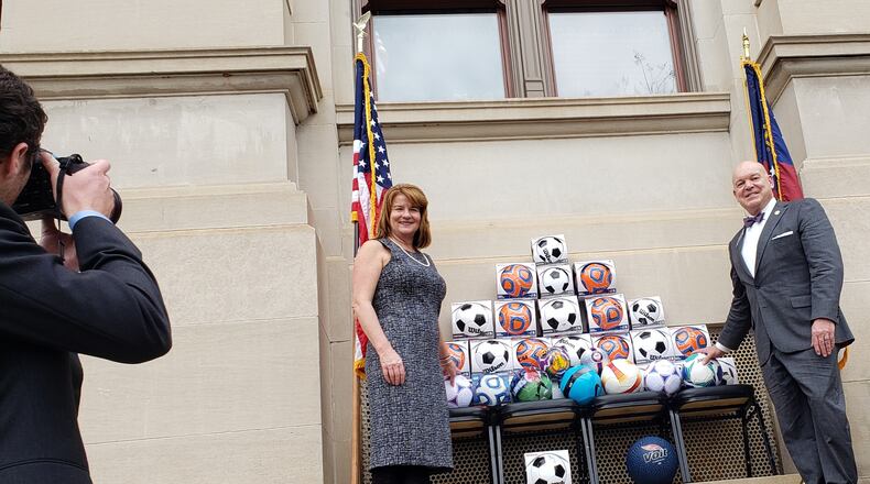 Boys and Girls Club of Metro Atlanta President and CEO Missy Dugan accepted a donation of about 50 soccer balls from her husband, Senate Majority Leader Mike Dugan. Maya T. Prabhu/maya.prabhu@ajc.com
