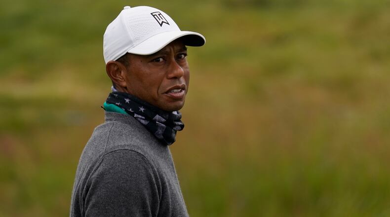 Tiger Woods is all bundled up for work on the practice putting green at TPC Harding Park in San Francisco, prior to the PGA Championship.