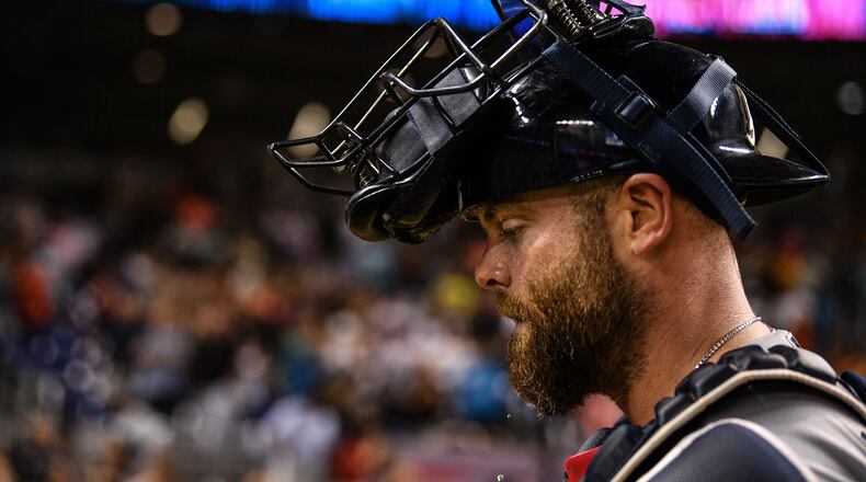 Braves catcher Brian McCann walks off the field in the tenth inning against the Miami Marlins Aug. 10, 2019, at Marlins Park in Miami.