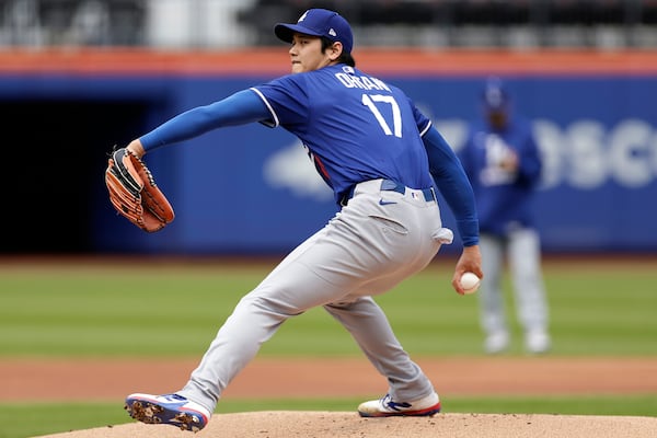 Los Angeles Dodgers' Shohei Ohtani (17), of Japan, throws live batting practice before a baseball game against the New York Mets on Sunday, May 25, 2025, in New York. (AP Photo/Adam Hunger)