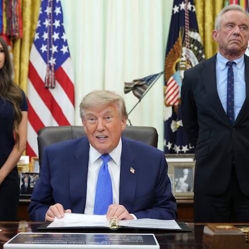President Donald Trump speaks as Health and Human Services Secretary Robert F. Kennedy Jr., right, and Jayme Franklin listen during a meeting to sign an executive order about vaccines, Monday, Aug. 10, 2026, in the Oval Office of the White House in Washington. (AP Photo/Jacquelyn Martin)