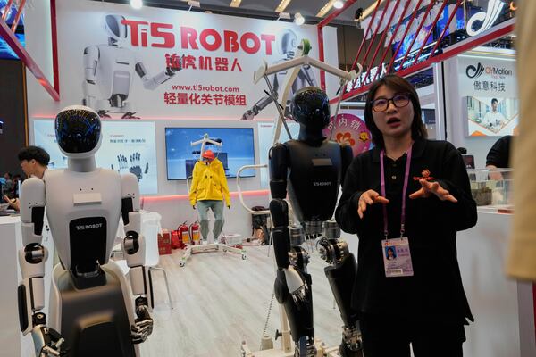 A vendor promotes robot from Ti5robot at the 137th Canton Fair in Guangzhou in southern China's Guangdong province on Wednesday, April 16, 2025. (AP Photo/Ng Han Guan)