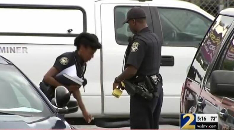 Police say two men argued out side an Autozone before one of them was shot. (Credit: Channel 2 Action News)