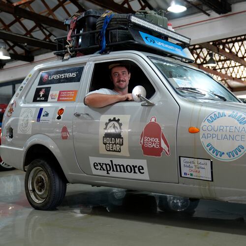Oliver Jenks poses with the Reliant Robin called "Sheila the three-wheeler" he and Seth Scott drove from London to Cape Town in a bid to break a Guinness World Record for being the first to do the journey in a three-wheeled car in Cape Town, South Africa, Friday, March 20, 2026. (AP Photo/Nardus Engelbrecht)