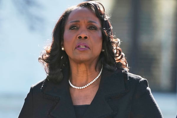 Federal Reserve Board of Governors member Lisa Cook leaves the U.S. Supreme Court in January. (Mark Schiefelbein/AP)