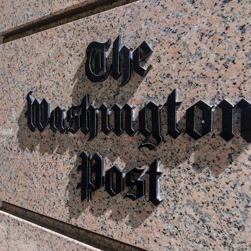 FILE - A person walks into the One Franklin Square Building, home of The Washington Post newspaper, June 21, 2024, in Washington. (AP Photo/Alex Brandon, File)