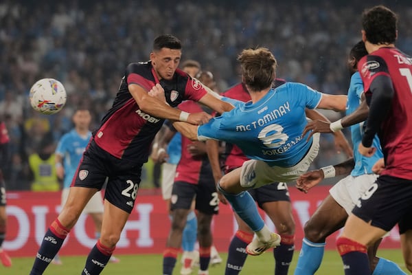 Napoli's Scott McTominay scores his side's first goal during the Italian Serie A soccer match between Napoli and Cagliari at the Diego Maradona stadium in Naples, Italy, Friday, May 23, 2025. (AP Photo/Gregorio Borgia)