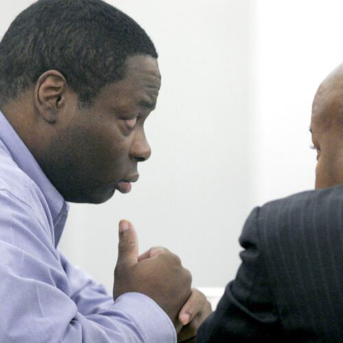 FILE - Edward Busby Jr., left, confers with attorney Steve Gordon on the second day of his capital murder trial, Nov. 10, 2005, in Fort Worth, Texas. (Rodger Mallison/Star-Telegram via AP, Pool, File)