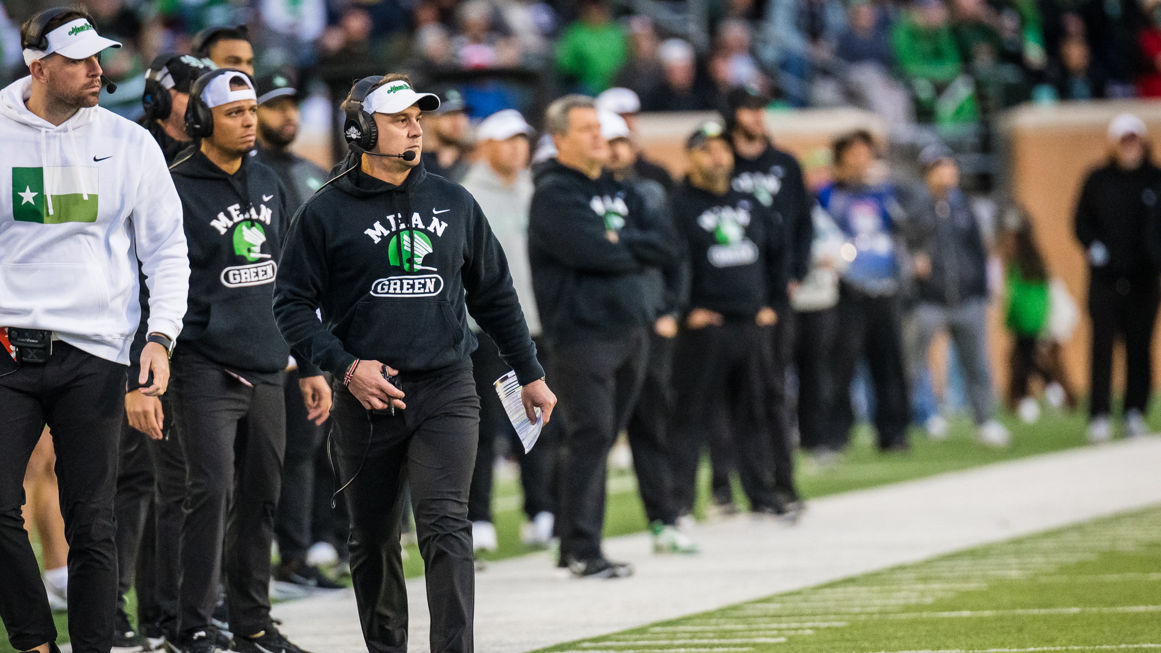 North Texas head coach Eric Morris, front right, walks the sideline during an NCAA college football game against Temple, Friday, Nov. 28, 2025, Denton, Texas. (AP Photo/Jessica Tobias)