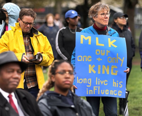 A woman holds a sign as hundreds of people hold a rally at the Parkman Bandstand on Boston Common on Saturday, April 26, 2025, to commemorate the 60th anniversary of the 1965 Freedom Rally on Boston Common which featured Martin Luther King Jr. (John Tlumacki/The Boston Globe via AP)