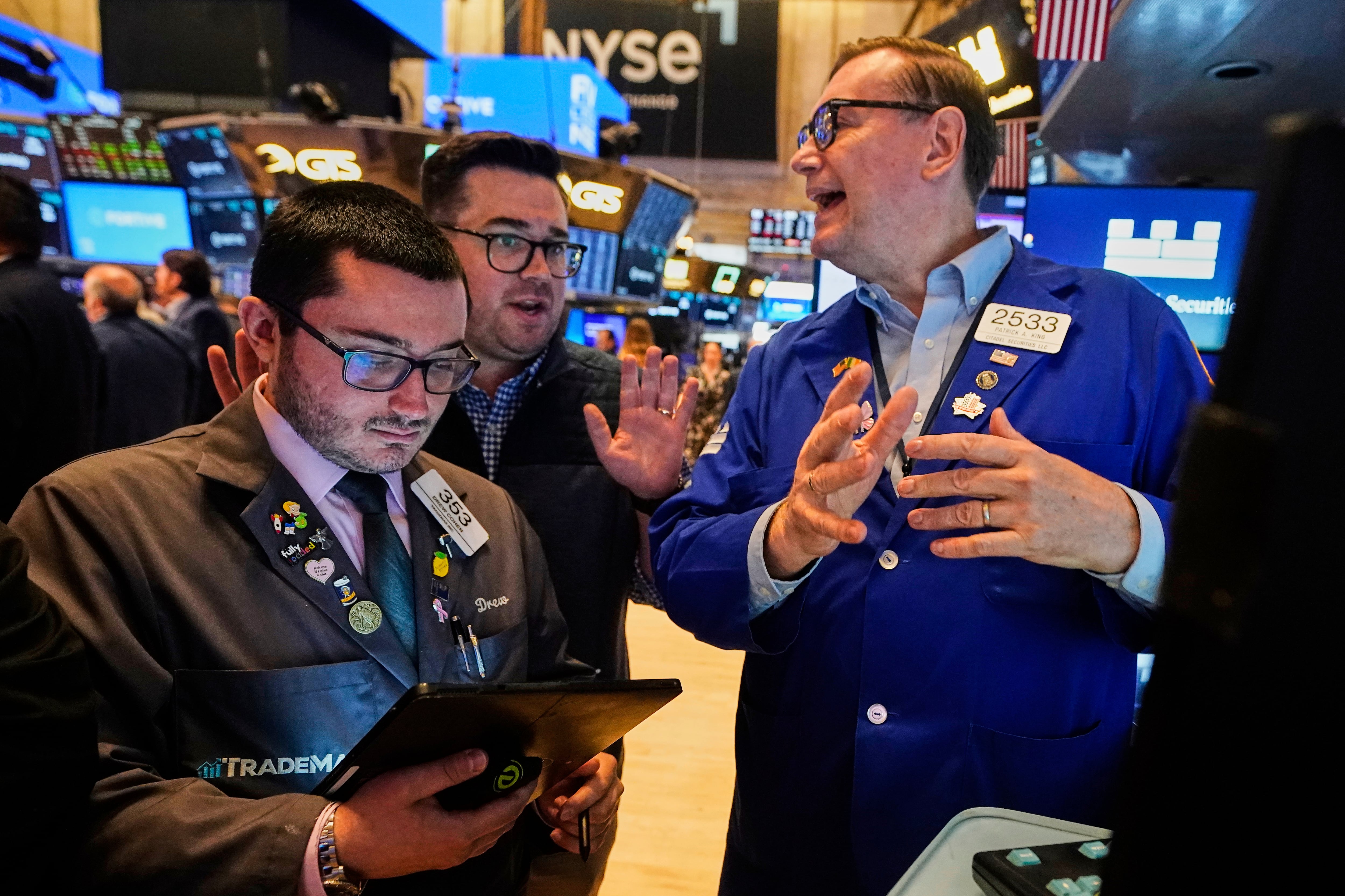 Dow drops nearly 300 after oil prices jump as Trump urges Iran's unconditional surrender