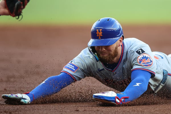 New York Mets' Brandon Nimmo steals third base in the third inning of a baseball game against the Atlanta Braves, Thursday, June 19, 2025, in Atlanta. (AP Photo/Colin Hubbard)