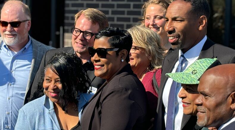 District 10 councilmember Andrea L. Boone (second left) and Mayor Andre Dickens (third right) outside the Hamilton Hills community in Southwest Atlanta. Tuesday, Oct. 8, 2024, in Atlanta. (Matt Reynolds/ AJC)