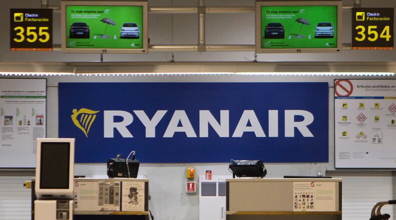 FILE - The Ryanair desk is seen, Aug. 10, 2018, at the Barajas airport in Madrid, Spain. (AP Photo/Paul White, File)