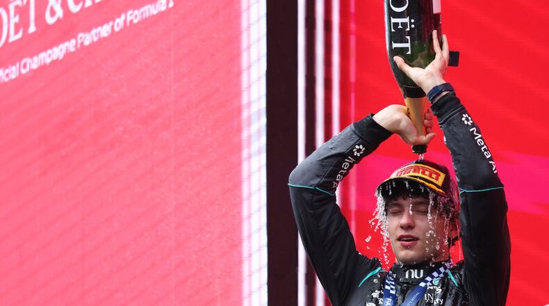 Mercedes driver Andrea Kimi Antonelli of Italy celebrates on the podium after winning the Formula One Grand Prix at the Spa-Francorchamps racetrack in Spa, Belgium, Sunday, July 19, 2026. (AP Photo/Omar Havana)