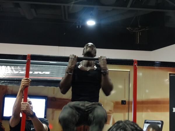 The Marines were testing people's upper body strength. Trainer Ty Tiamiyu (tybody.com) did 22 pull ups. CREDIT: Rodney Ho/ rho@ajc.com
