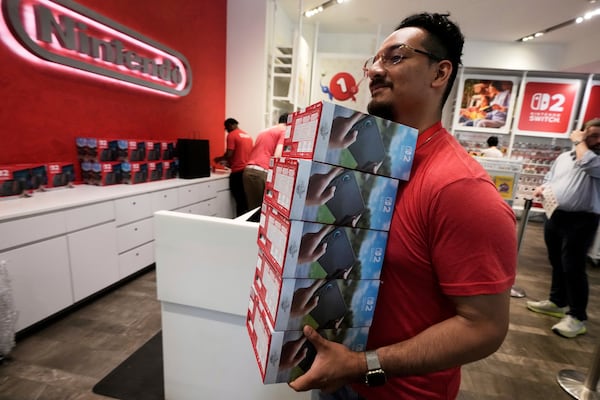 A stack of Nintendo Switch 2 devices is restocked at the Nintendo store in New York's Rockefeller Center, Thursday, June 5, 2025. (AP Photo/Richard Drew)