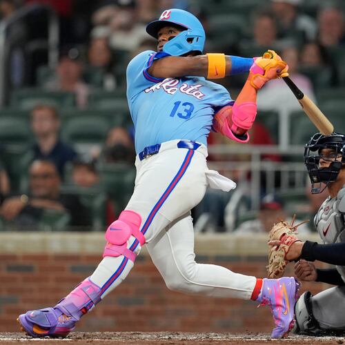 Atlanta Braves' Ronald Acuña Jr. (13) hits a solo homer in the sixth inning of a baseball game against the Cleveland Guardians, Friday, April 10, 2026, in Atlanta. (AP Photo/Mike Stewart)
