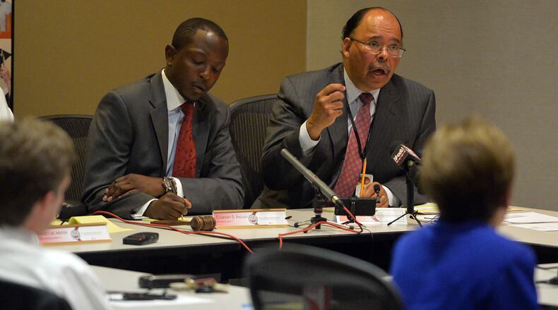 Former Atlanta School Superintendent Erroll Davis (right), makes a presentation as Atlanta School Board chairman Courtney English takes notes. Members of the Atlanta Board of Education and the Atlanta City Council met at APS headquarters Tuesday, July 8, 2014, to receive information related to the Intergovernmental Agreement between the City of Atlanta, Invest Atlanta and the Atlanta Independent School System regarding the Beltline project.