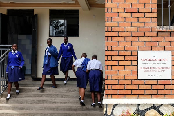 Students walk out of the classroom during lunch break at Uganda Martyrs' Secondary School Namugongo, in Kampala, Uganda Monday, May 26, 2025. (AP Photo/Hajarah Nalwadda)