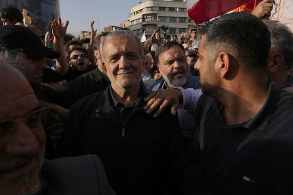 Iranian President Masoud Pezeshkian attends a protest following the U.S. attacks on nuclear sites in Iran, in Tehran, Iran, Sunday, June 22, 2025. (AP Photo/Vahid Salemi)