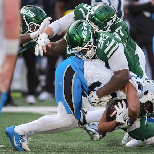New York Jets defensive tackle Quinnen Williams (95) tackles Carolina Panthers running back Chuba Hubbard (30) during the fourth quarter of an NFL football game, Sunday, Oct. 19, 2025, in East Rutherford, N.J. (AP Photo/Seth Wenig)