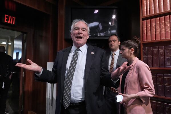 Sen. Tim Kaine, D-Va., lingers for additional questions from reporters after he and other Democrats spoke about President Donald Trump's tariffs on foreign countries, at the Capitol, in Washington, Wednesday, April 2, 2025. (AP Photo/J. Scott Applewhite)