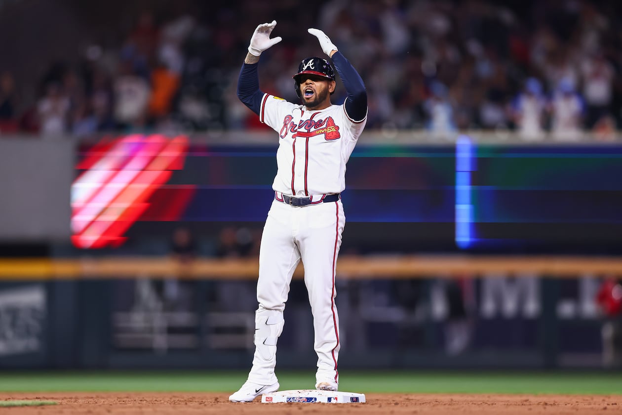 Atlanta Braves designated hitter Dominic Smith reacts at second base after hitting a bases-clearing double in the eighth inning of a baseball game against the Miami Marlins, Tuesday, April 14, 2026, in Atlanta. (AP Photo/Colin Hubbard)