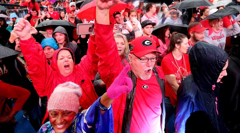 Jim Maynard and his wife Michelle of Fayetteville cheer at the Georgia pep rally during the Allstate Fan Fest for the Sugar Bowl on Monday, Dec 31, 2018, in New Orleans.