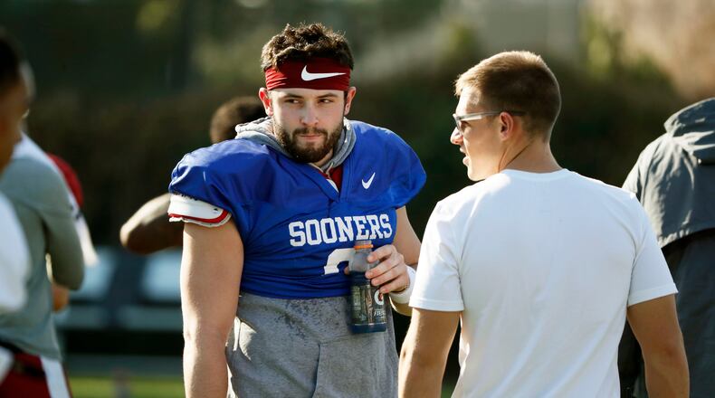 12/29/17 - Los Angeles - Oklahoma quarterback Baker Mayfield takes a breather after he participated in drills during a short segment of practice at the StubHub Center that was open to the media.  He missed his scheduled appearance at this morning's Offensive coordinator and offensive player press conference.  He reportedly has been  recovering from the flu over Christmas break. He also missed the trip to Disneyland on Wednesday with the illness.   Oklahoma plays Georgia in a NCAA semifinal playoff game at the Rose Bowl on Monday.  BOB ANDRES  /BANDRES@AJC.COM