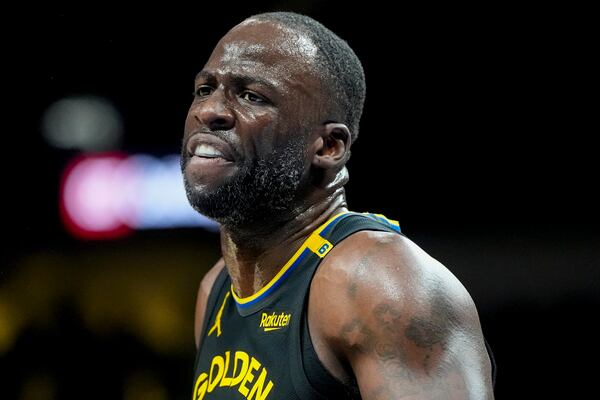 Golden State Warriors forward Draymond Green (23) speaks to an official during the first half of an NBA basketball game against the Atlanta Hawks, Saturday, March 22, 2025, in Atlanta. (AP Photo/Mike Stewart)