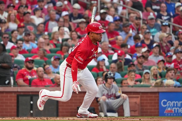 St. Louis Cardinals' Willson Contreras follows through on an RBI single during the first inning of a baseball game against the Atlanta Braves Friday, July 11, 2025, in St. Louis. (AP Photo/Jeff Roberson)