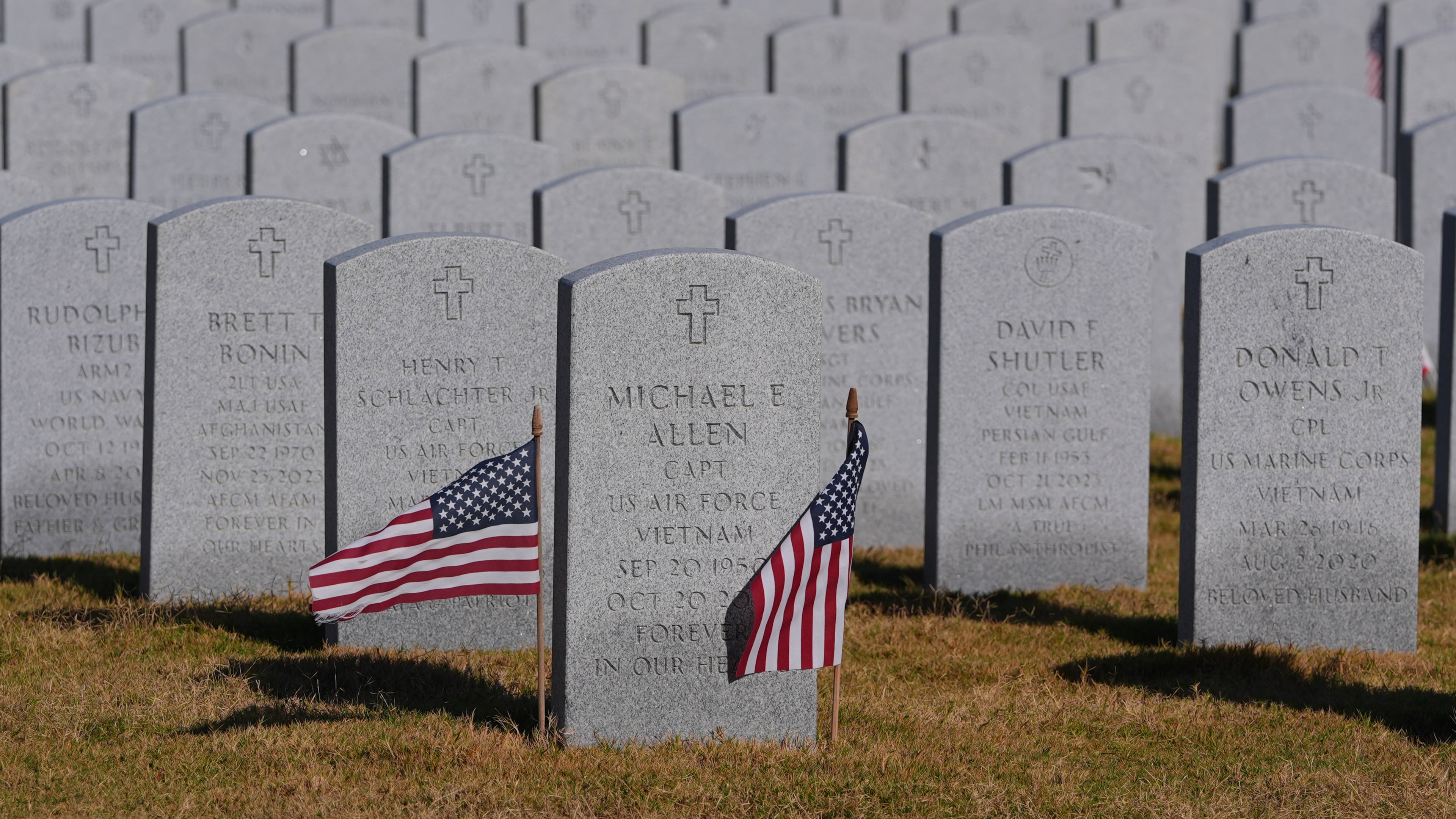 Grave markers of U.S. veterans are shown at the Dallas-Fort Worth National Cemetery where the upcoming annual Veterans Day program has been canceled due to the federal government shutdown in Dallas, Tuesday, Nov. 4, 2025. (AP Photo/LM Otero)