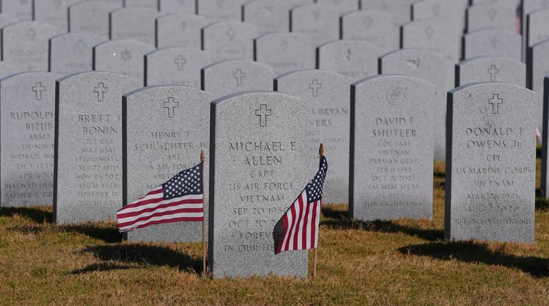 Grave markers of U.S. veterans are shown at the Dallas-Fort Worth National Cemetery where the upcoming annual Veterans Day program has been canceled due to the federal government shutdown in Dallas, Tuesday, Nov. 4, 2025. (AP Photo/LM Otero)