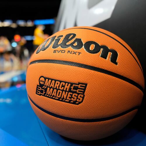 A March Madness basketball rests on the court as Iowa runs drills during practice at the NCAA college basketball tournament Thursday, March 19, 2026, in Tampa, Fla. (AP Photo/Chris O'Meara)