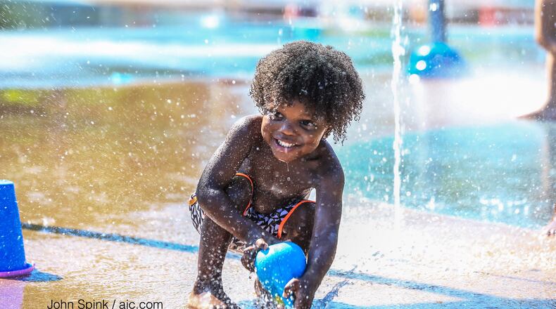 Two-year-old Tre Toole decided to cool off in the Historic Old Fourth Ward Splash Pad in this AJC file photo.